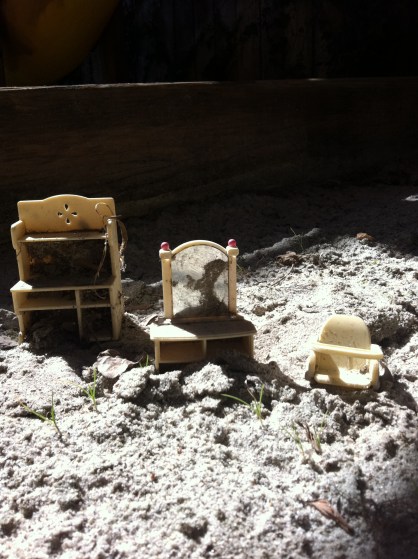 Tiny furniture left behind in our sand box.